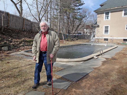 Robert Wisner stands in his South Nyack backyard, where about one-third of his property was recently taken by the state through eminent domain proceedings to be used for the bike and walking path that will be part of the new Tappan Zee Bridge, on March 27, 2014. His two-family home was left out of the deal.